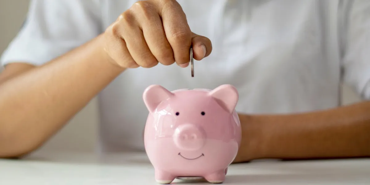 women put silver coins into piglets to save money and save money for future investment financial concept women put silver coins into piglets to save money and save money for future investment financial concept